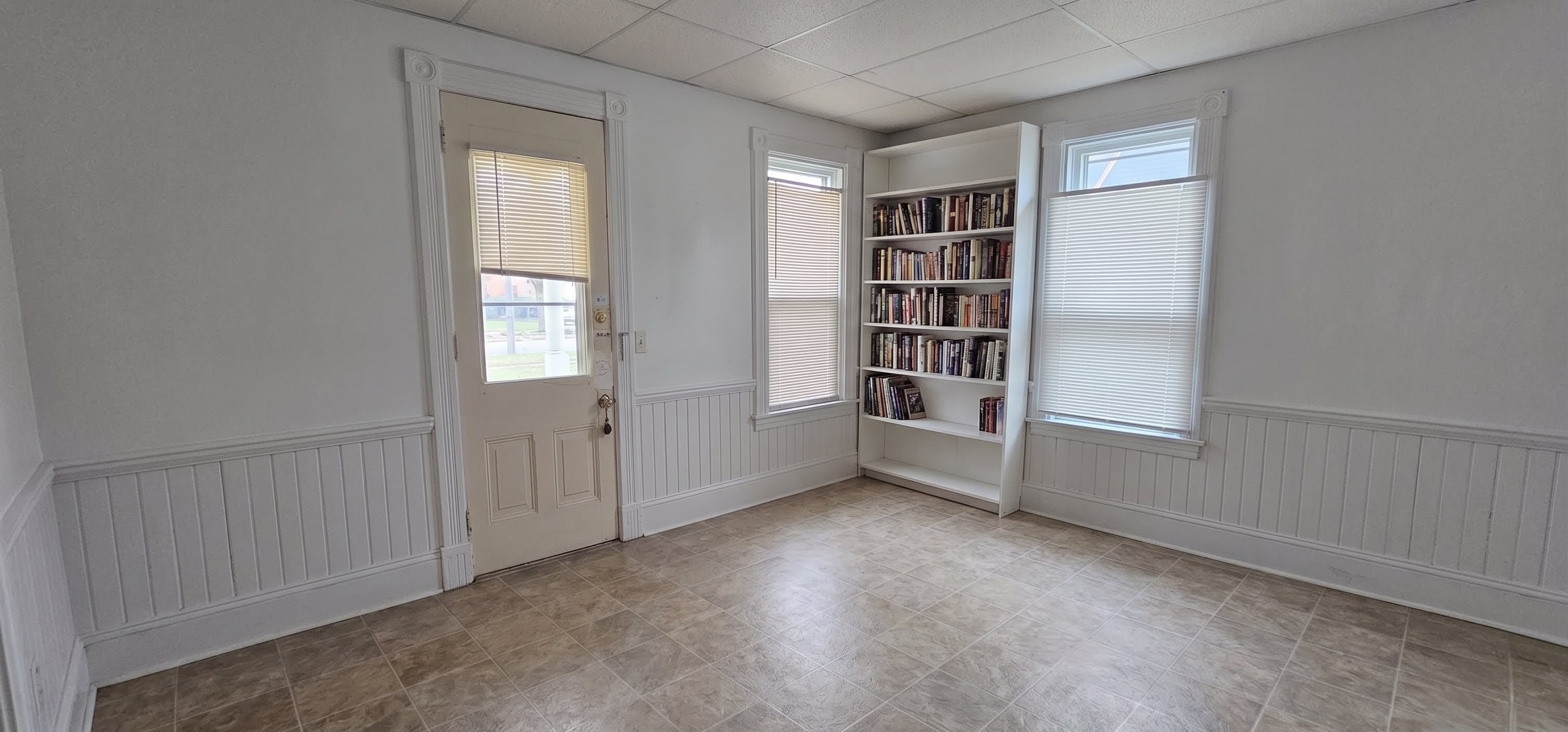 306 Unit 2 Living Room &mdash; bright living area with built-in bookshelf